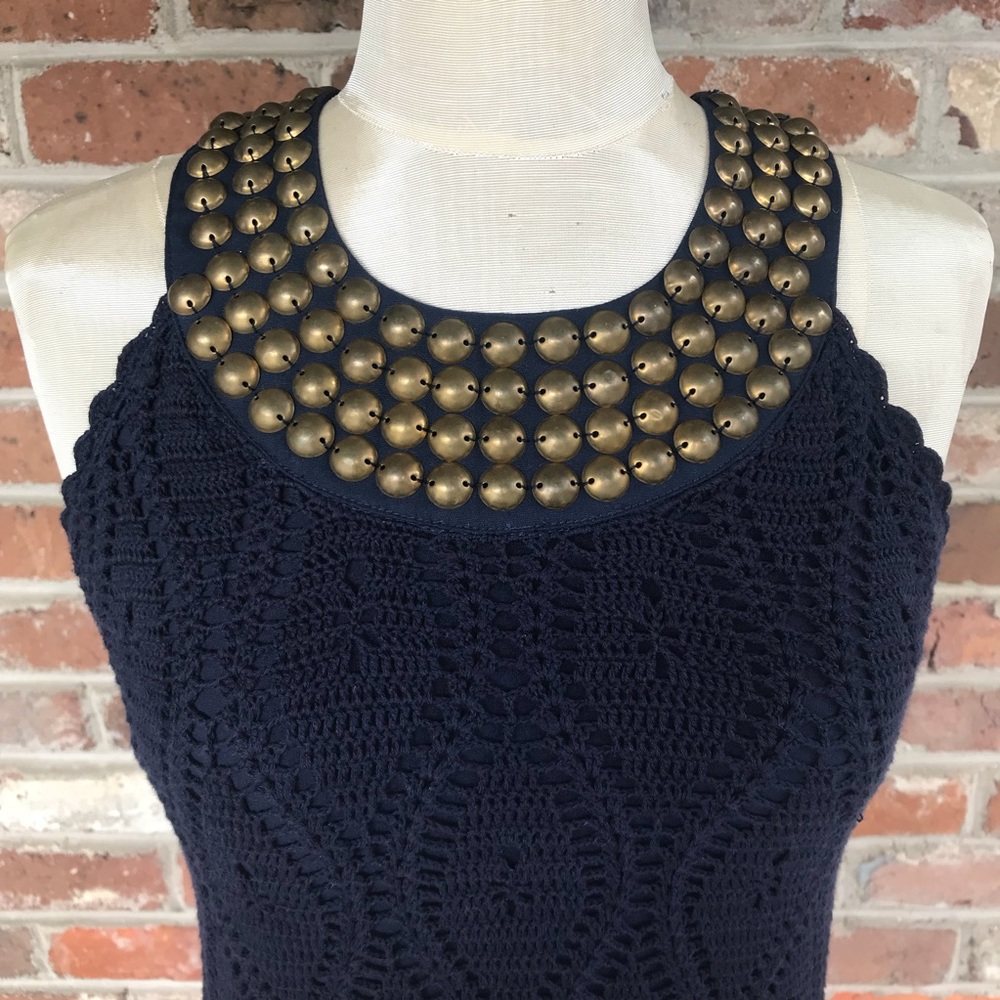 Gorgeous sleeveless knit top w/ brass studded neck